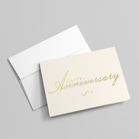 cream anniversary card with gold text and white envelope