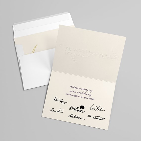 greeting card with embossed text and printed message, white envelope