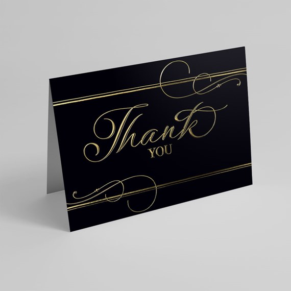black thank you card with gold foil text and decorative elements