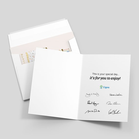 open greeting card with colorful design and signatures