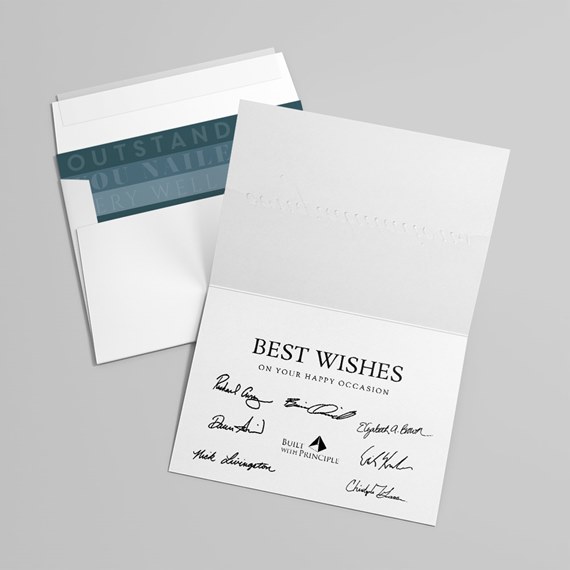 white greeting card with black text and signatures, dark blue envelope