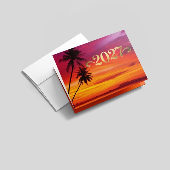greeting card with sunset design and palm trees