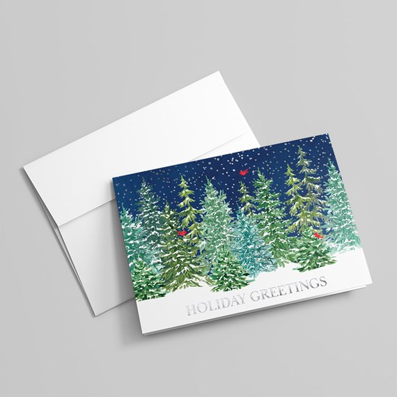 holiday greeting card with snowy forest scene