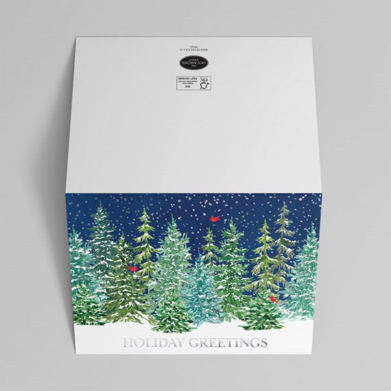 holiday greeting card with evergreen trees and snowflakes