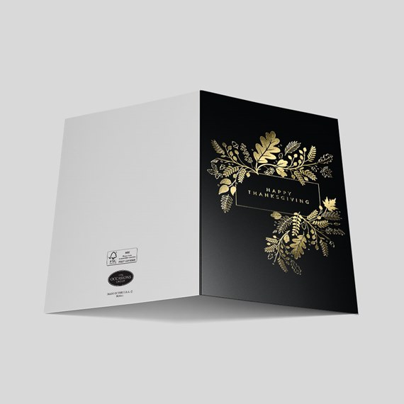 black card with gold floral design and text photo area