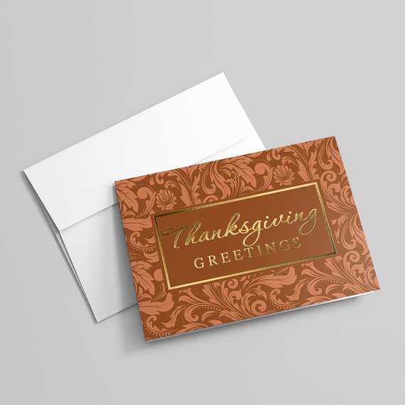 decorative greeting card with floral patterns and gold text