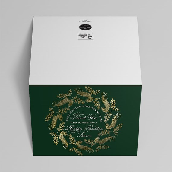 dark green card with gold wreath and text