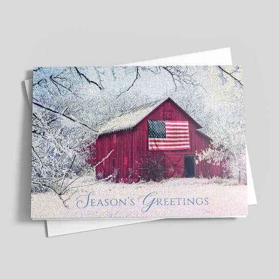 red barn with american flag, snowy landscape, season's greetings text