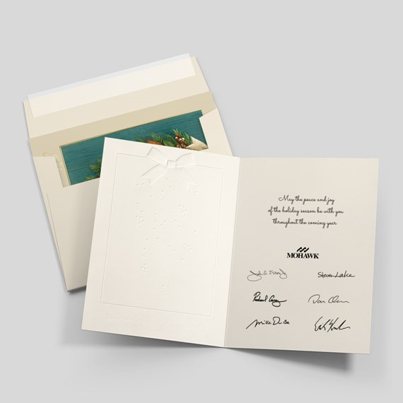 holiday greeting card with embossed bow and printed message