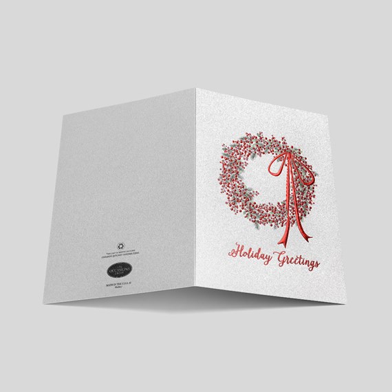 holiday card with wreath and red ribbon