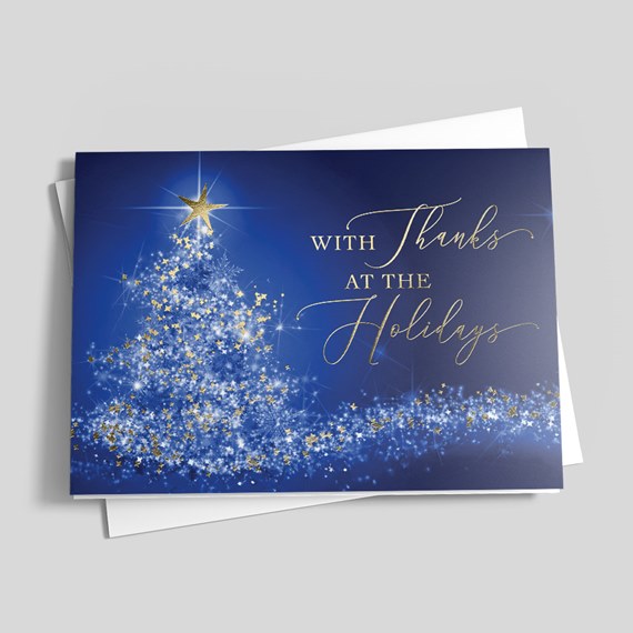 holiday card with blue Christmas tree and gold foil text