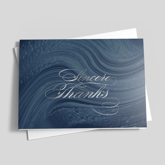 thank you card with wavy blue design and silver text