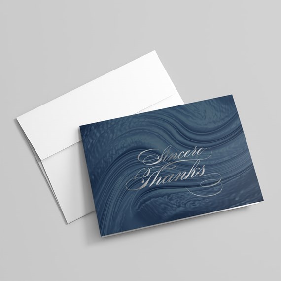 thank you card with swirling blue design and silver text
