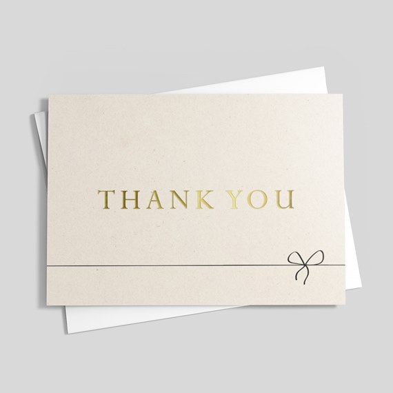 thank you card with gold foil text and black bow