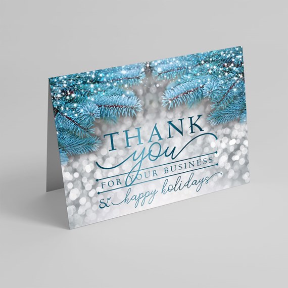 winter greeting card with text and pine branches