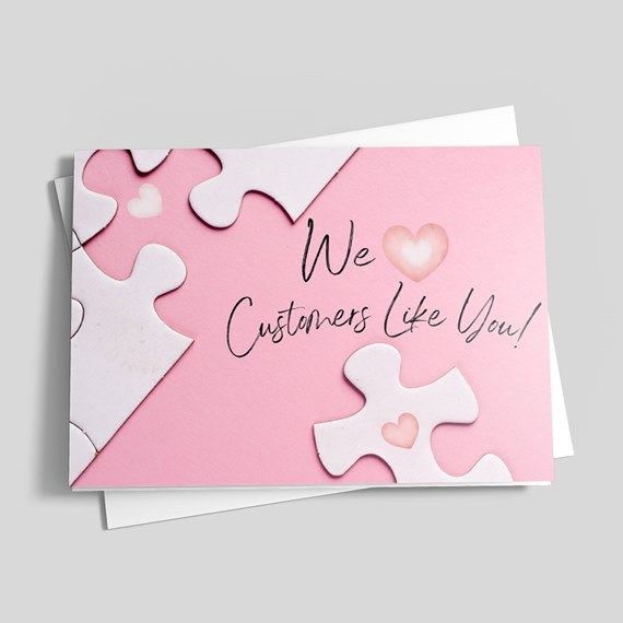 greeting card with puzzle design and heart shape