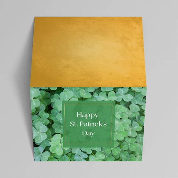greeting card with a clover design and gold back