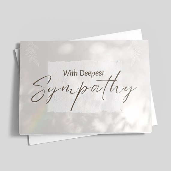 sympathy card with textured background and floral accents