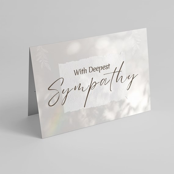 sympathy card with decorative text and leaf patterns