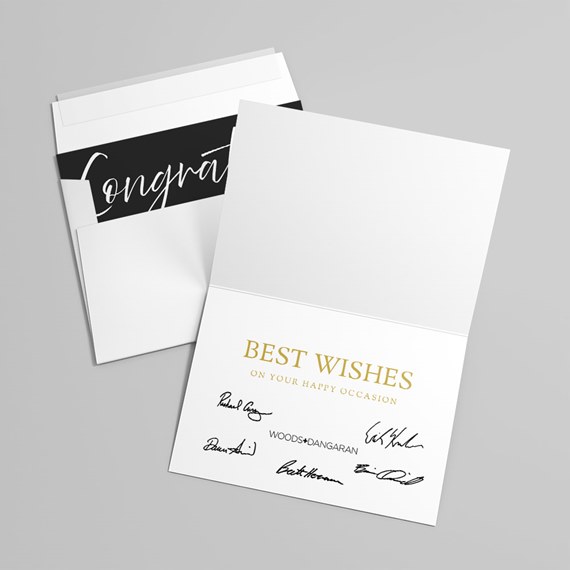 greeting card with black and white design and gold text