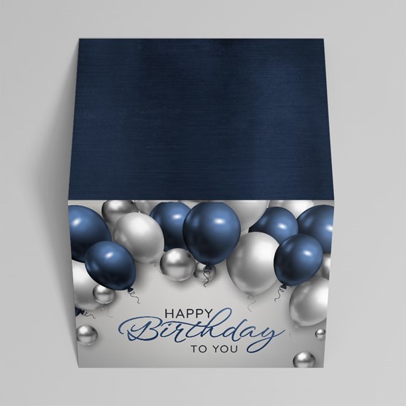 cube-shaped birthday design with balloons and text placeholder