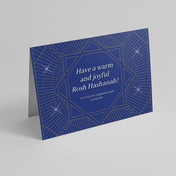 blue greeting card with geometric star pattern and text