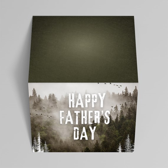 cube-shaped product with forest design and text