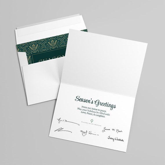greeting card with dark green patterned interior and seasonal message