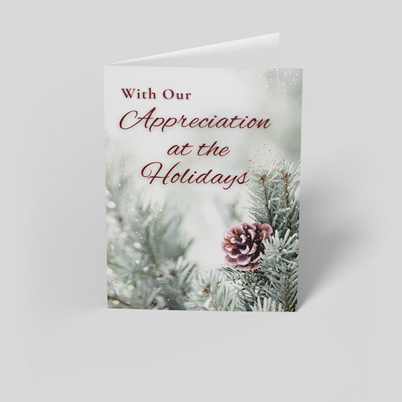 holiday card with pine cone and evergreen design