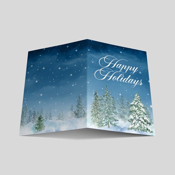 holiday card design with snow and evergreen trees