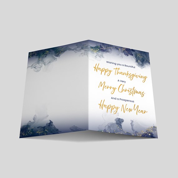 folded card with floral watercolor design and gold text