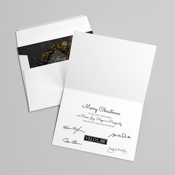 folded card with black and gold design, photo placeholder