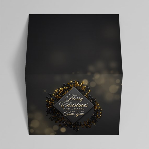 decorative black box with holiday message and bead design