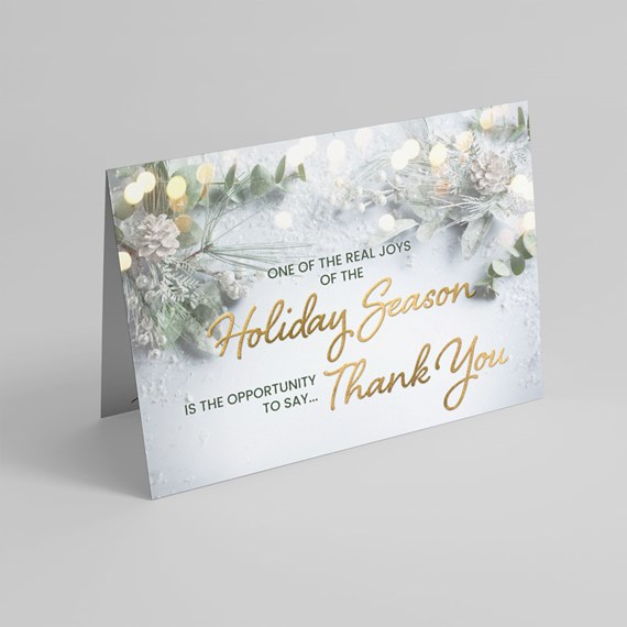 Greeting card with floral and pine elements, holiday theme, thank you message