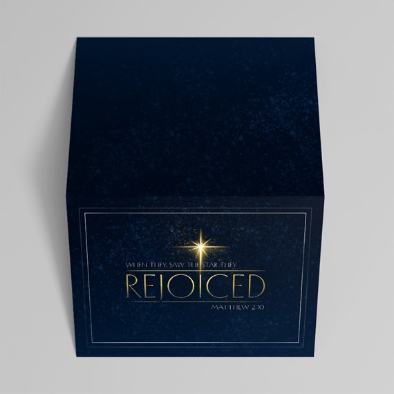 decorative box with religious text and star graphic