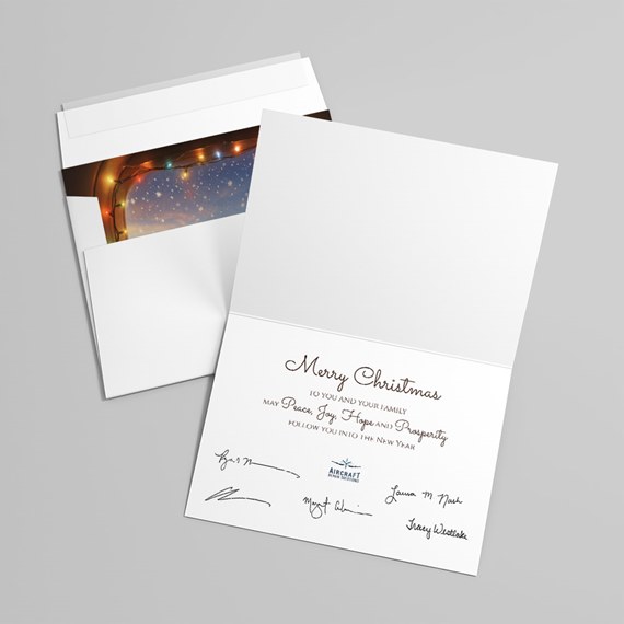 folded greeting card with string lights and starry background