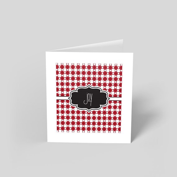 greeting card with red checkered pattern and black label