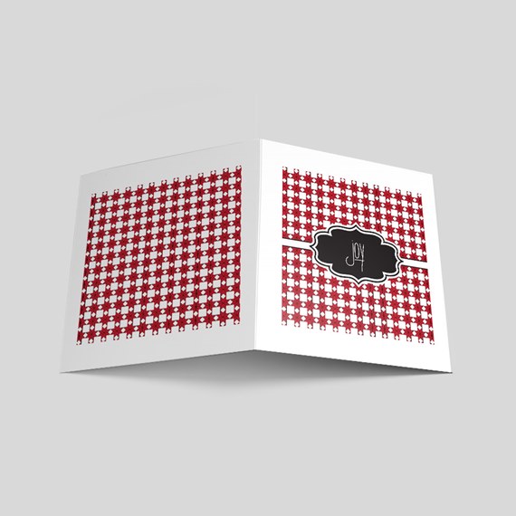 greeting card with checkered pattern and black label