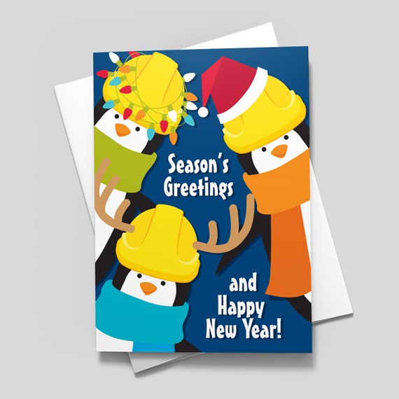 festive penguin card with greeting text