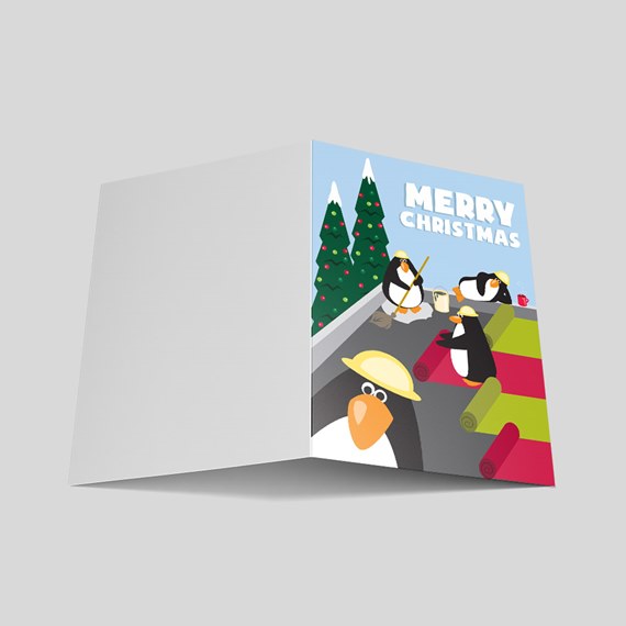 Christmas card with cartoon penguins and trees