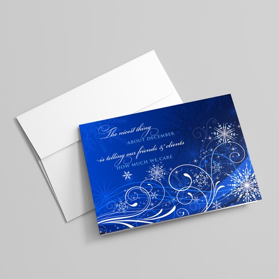 blue card with white swirls and snowflakes