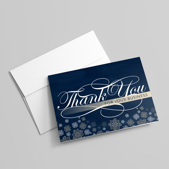 navy thank you card with snowflake design and beige ribbon