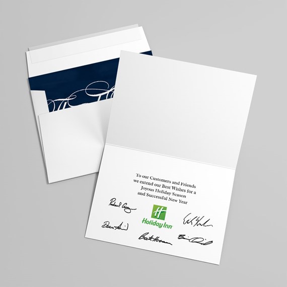 folded card with holiday greetings and envelope
