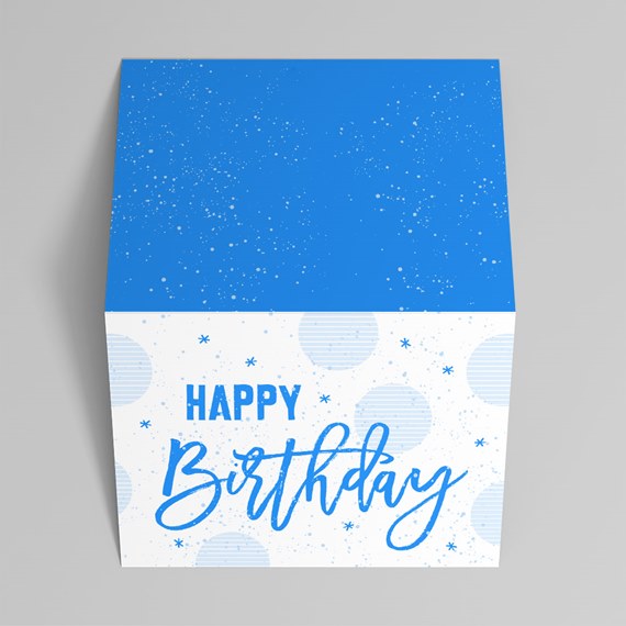 blue birthday gift box with speckled top and light blue design elements