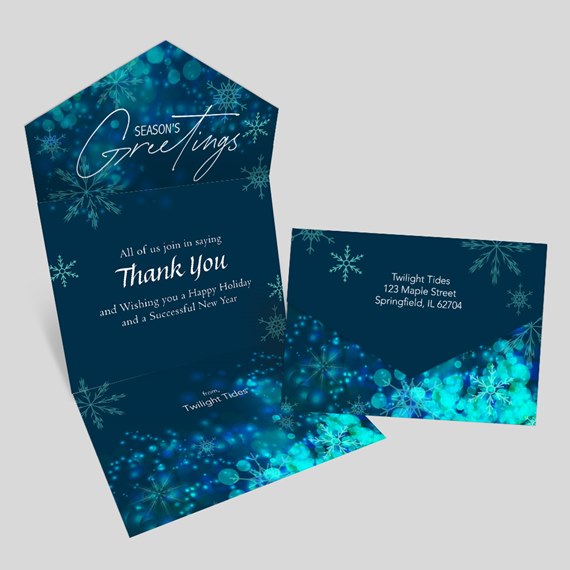 greeting card with snowflakes and bokeh design